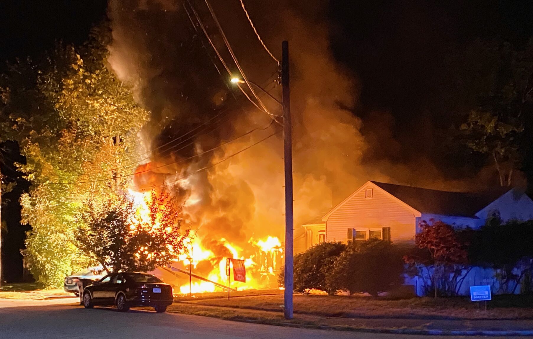 Fire destroys vehicles, burns home